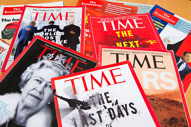 Popular Magazines Shanghai, China - Oct 2, 2013: Popular Magazines in English language displayed, including Time and The Economist. Magazines are a great way to learn news, culture and short stories. They generate the majority of their income through advertising. newspaper seller stock pictures, royalty-free photos & images