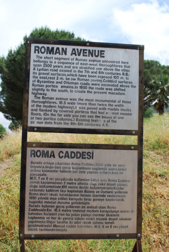 Manisa, Turkey - May, 22 2010:  Roman Avenue information sign in the ancient city Sardis. Sardis was the capital of the ancient kingdom of Lydia.
