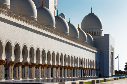 Abu Dhabi, UAE - May 11, 2013: Sheikh Zayed Grand Mosque, Abu Dhabi. The 3rd largest mosque in the world, area is 22,412 square meters and the 4 minarets are 107 m high. It host 1048 majestic columns. Gold gilding is common throughout the mosque