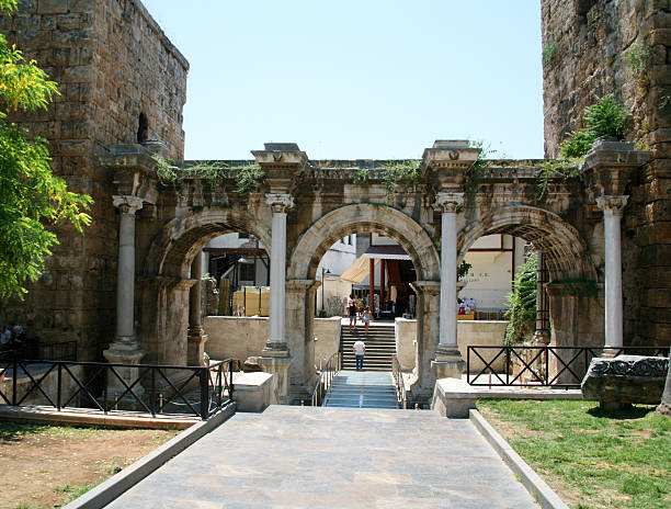 Hadrian's Gate, Antalya - Turkey Antalya, Turkey - July 10, 2012: People walks in Hadrian's Gate, Antalya - Turkey belek town stock pictures, royalty-free photos & images