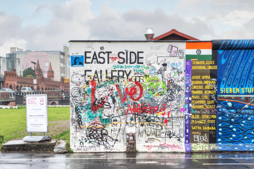 Berlin, Germany - September 24, 2013: The starting title of the East Side Gallery, an international memorial for freedom with 105 paintings by artists from all over the world on a 1,3 km long section of the remnants of the Berlin Wall.