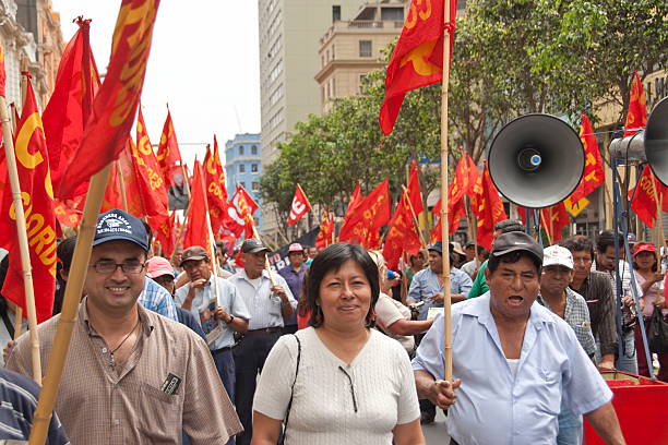 Lima, Peru - May 1st, 2010: Unidentified people take part at May Day demonstration on May 1, 2010 in Lima, Peru. They demand on solution of many social issues, such as corruption, unemployment, etc.