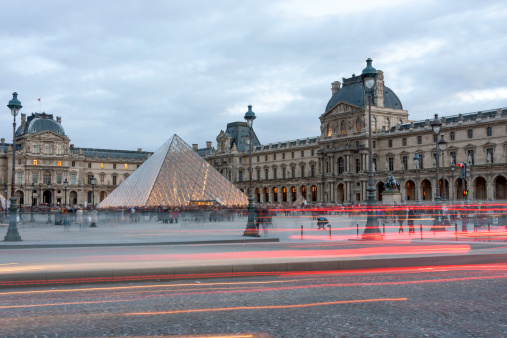 Paris, France - December 30, 2012: Pyramid of the Louvre in the cloudy evening on December 30, 2012 in Paris, France
