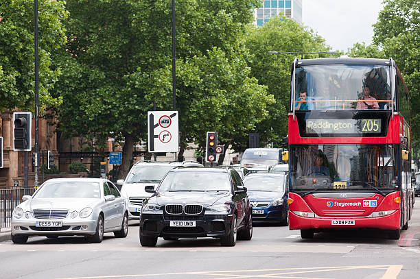 west ロンドンの交通状況 - bus taxi london england double decker bus ストックフォトと画像