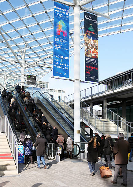 Macef, International Home Show Milan, Italy - January, 24 2013: People at the entrance of Fiera di Milano walt on the elevator to Macef, International Home Show. fiera stock pictures, royalty-free photos & images