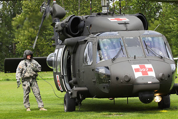 Eugene, Oregon, USA aa May 2, 2012: In the urban town of Eugene, OR the local Emergency Services and National Guard work together in a disaster response drill. The flight crew is standing by waiting for the injured to arrive.