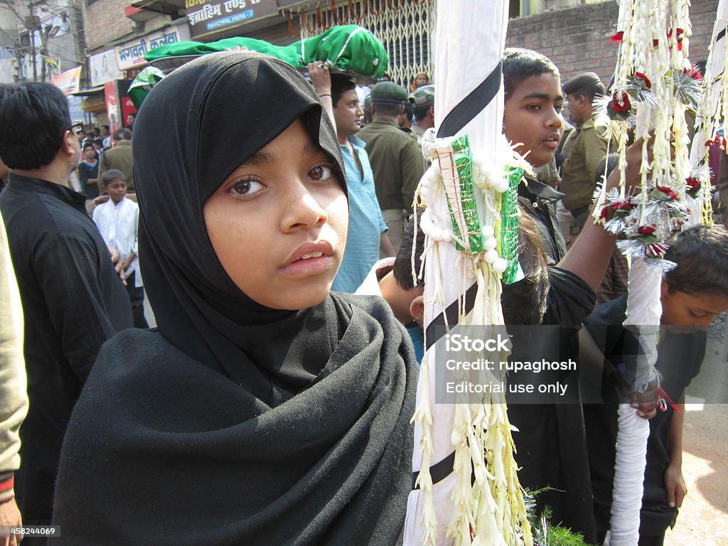 Young Shi’ite girl and boys at Alam procession during Muharram. Patna, Bihar, India. November 25, 2012:Young Muslims carrying sehera during Alam procession at Muharram. Shiaaite Muslims mourned and lamented at Ashok Rajpath, Patna, Bihar during Muharram. Muharram is an important period of mourning in Shiaaite Muslim. Bihar Stock Photo