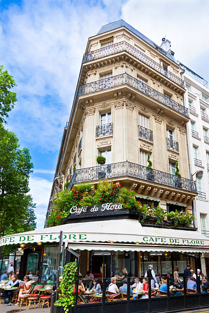 Cafe de Flore, Paris, with tourists eating outside. stock photo