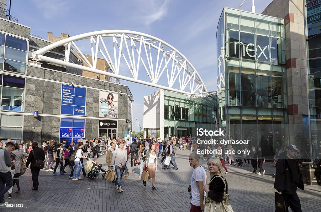 Shoppers in central Birmingham, England Birmingham, United Kingdom - September 15, 2012: Shoppers in an pedestrianised area outside the Bullring shopping centre. The Bullring shopping centre in the centre of Birmingham was re-developed in early 2000 and has become one of the most popular shopping areas in the UK and the hub of a major commercial area within central Birmingham. Bullring Shopping Centre Stock Photo