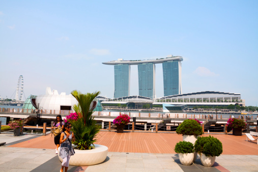 singapore. 14 th april, 2023: marina bay is the most remarkable landmark of the city in singapore. it is surrounded by an avantgarde skyline and the famous marina bay sands building.