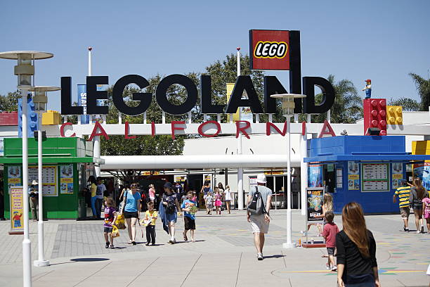 San Diego, CA, USA - August 27th, 2012: A crowd of visitors entering and exiting the entrance of the Legoland California theme park located in San Diego, California.