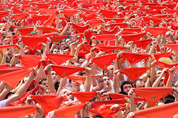 People welcome red scarfs opening of San Fermin festival stock photo