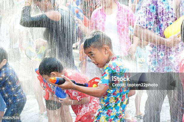 Child Playing Water Festival In Thailand Stock Photo - Download Image Now - Adult, Aiming, Asia