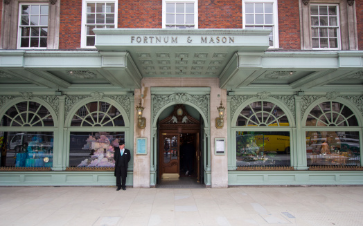 London, UK - July 26, 2011: Doorman in front of Fortnum and Mason department store on July 26, 2011 in London, UK
