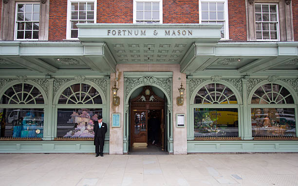 Fortnum and Mason, London London, UK - July 26, 2011: Doorman in front of Fortnum and Mason department store on July 26, 2011 in London, UK door attendant photos stock pictures, royalty-free photos & images