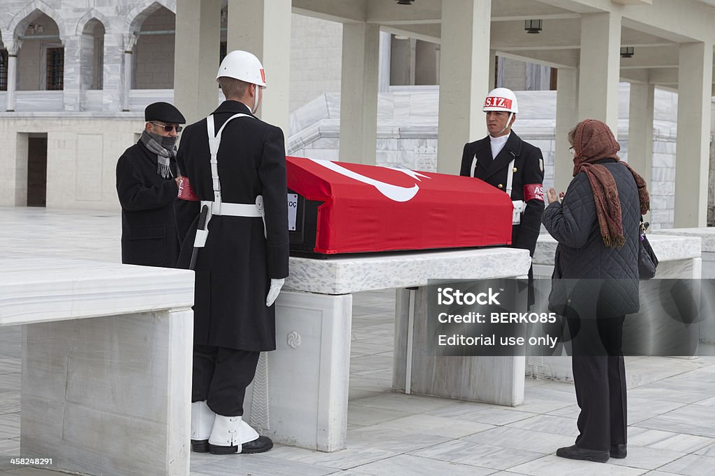 Funeral of a Hero Ankara, Turkey-March 24, 2013: Two Turkish soldiers are on honor guard for a fallen hero outside the iconic Kocatepe Mosque in Turkish capital Ankara ,while two of the relatives praying Ankara - Turkey Stock Photo