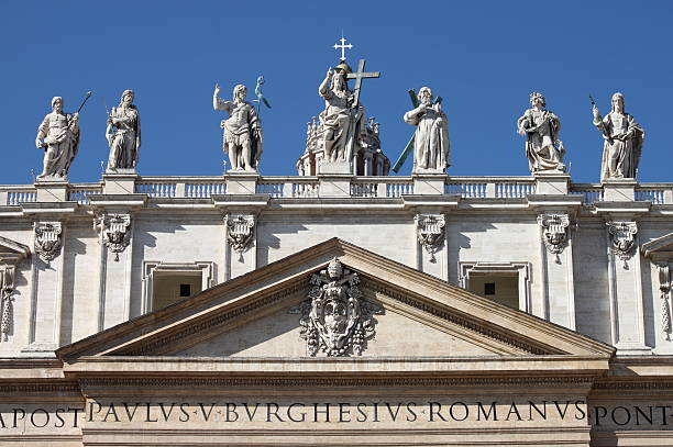 Statues on the top of Saint Peter Basilica facade stock photo