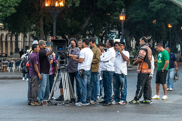 Havanna, Cuba - January 23, 2012: couple of indian filmmakers standing in Havanna City close to the producer and discuss something about a scene that will be taped soon