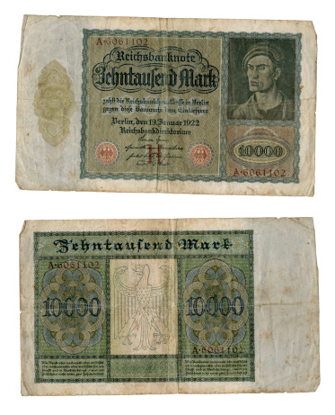 London, England - September 24, 2012: An old 1922 German banknote for 10,000 marks, sometimes known as the 'Vampire' note because when viewed sideways, it appears as if a vampire is biting the neck of the man (it is not easy to see at first): the engraving is Albrecht Durers Portrait of a Young Man but was slightly altered by the banknote engraver to show this so-called vampire apparently sucking the lifeblood out of the German economy with the reparations imposed after World War One. The 10,000 mark note was first issued in 1922 in a time of spiralling inflation.