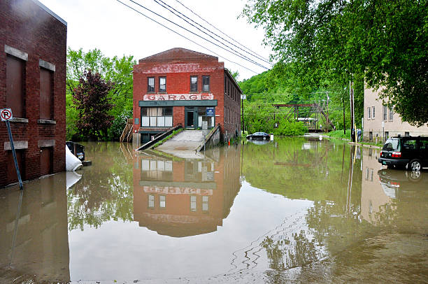 Montpelier, VT, USA - May 27, 2011: A major spring caused  flash flooding in low lying areas of Montpelier. This public parking lot off State Street was submerged with several feet of water overnight and basements of adjacent businesses were flooded out.