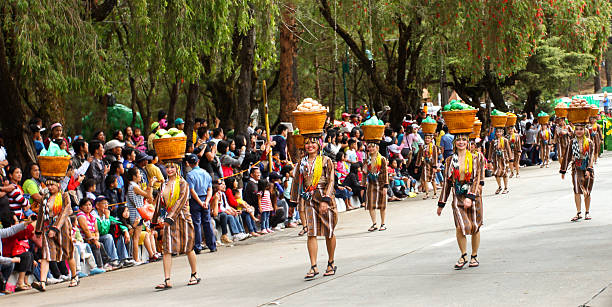 Panagbenga Festival Baguio City, Philippines - February 23, 2013: Street dancing participants nearing the entrance of the Athletic Bowl for the dance finale during the "Panagbenga Festival" , an annual flower festival held in the summer capital in the Philippines held every February to commemorate the devastation of the city way back 1995 because of earthquake. igorot stock pictures, royalty-free photos & images