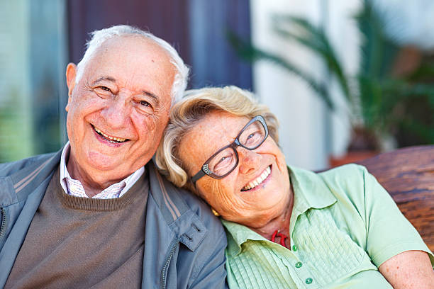Elderly couple laughing stock photo