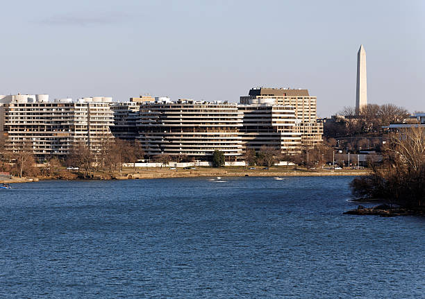 The Watergate Complex Washington, DC, USA – February 20, 2013: The Watergate Complex as seen from across the Potomac River. The Watergate complex is a group of five buildings in the Foggy Bottom neighborhood of Washington, DC. hotel watergate stock pictures, royalty-free photos & images