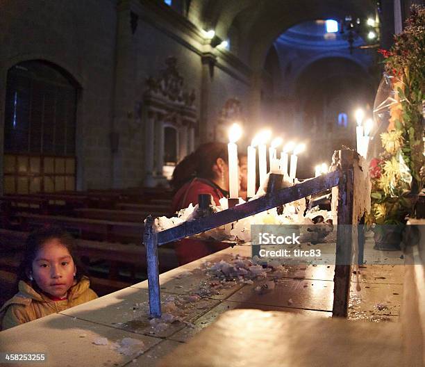 Hispanic Girl Praying At Church Candles Stock Photo - Download Image Now - Adult, Altar, Atmospheric Mood