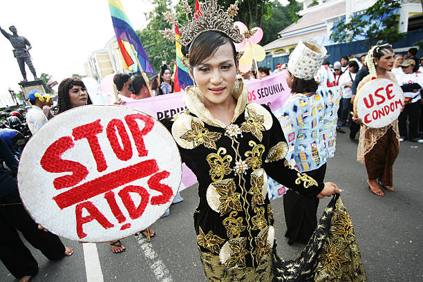 Transgender Community Mark World AIDS Day Solo, Indonesia - November 30, 2008: Transgender woman and HIV-positive activists participated in an unsanctioned demonstration to mark World AIDS Day in Solo, Central Java, Indonesia aids walk stock pictures, royalty-free photos & images