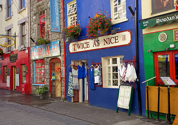 Galway, Ireland - August 18, 2012: Early in the morning in the major tourist attraction of Quay Street, Galway. With many tourist-focused shops, restaurants and pubs, Quay Street is in the historical heart of Galway.
