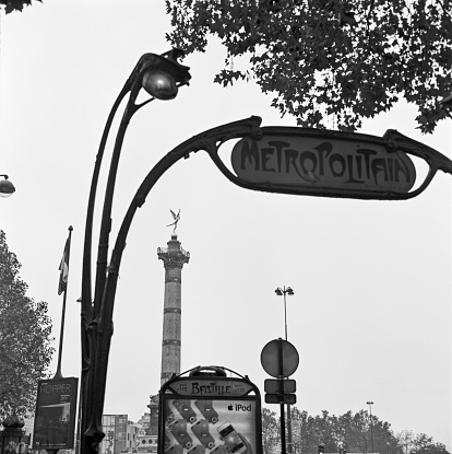 Paris, France - November 18, 2012: the iconic signs placed over the entrances to the underground station are amongst the most photographed corners of Paris. This particular one is placed in front of 