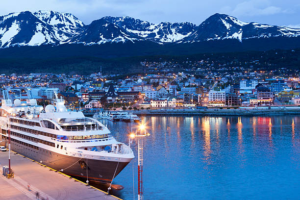 Argentina Ushuaia bay at Beagle Channel by night Ushuaia, Argentina - December 01, 2012: Cruise ship "L&amp;amp;acute;Austral Mata Utu" lying at pier in Ushuaia, Capital of the Tierra del Fuego Province in Argentina at night. Over the city the Martial mountains tierra del fuego archipelago stock pictures, royalty-free photos & images