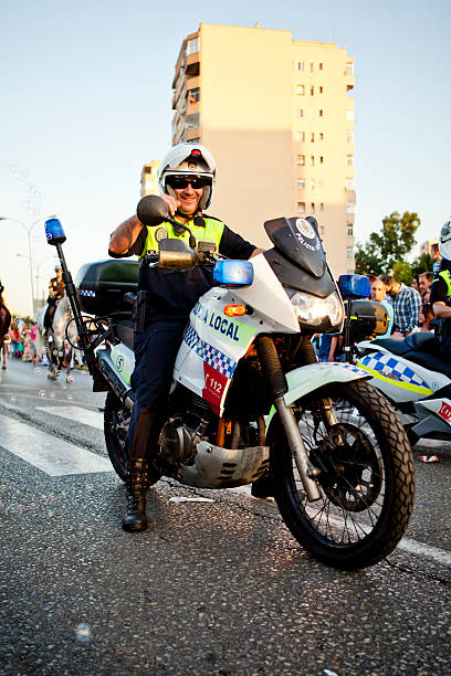 Algeciras, Spain - June 16, 2012: A motorcycle policeman participates in a traditional Spring parade marking the beginning of the annual Feria in Algeciras, Spain. The Algeciras Fair (Spanish: Feria de Algeciras) is held in the Andalusian city of Algeciras, Spain. The fair generally begins in the third week of June and lasts for one week.