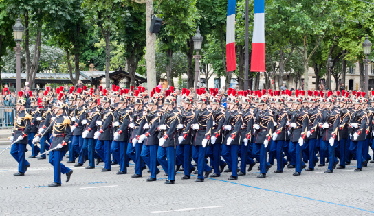 Paris, France - July 14, 2012: Army columns marching at a military parade in  Republic Day (Bastille Day) on Champs Elysees.