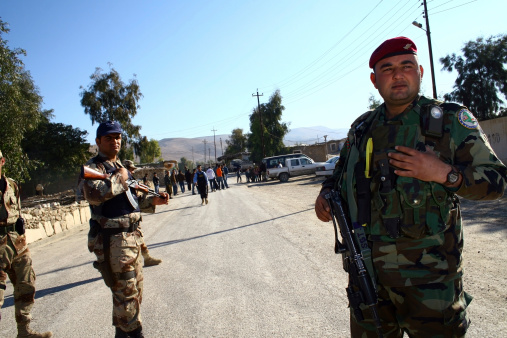 Maxmur, Iraq -January 26, 2007 : Iraqi soldiers stand guard at a check point on January 26, 2007 in Maxmur, Iraq.