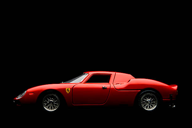 Kampen, The Netherlands - July 30, 2013: Studio shot of a rRed Ferrari 250 LM BBurago model car on a black background. The Ferrari 250 LM is a V12 race car produced in the 1960s and 1970s.