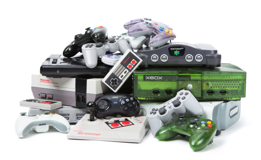 Taipei, Taiwan - November 13, 2012: This is a studio shot of various game systems and controllers isolated on a white background.