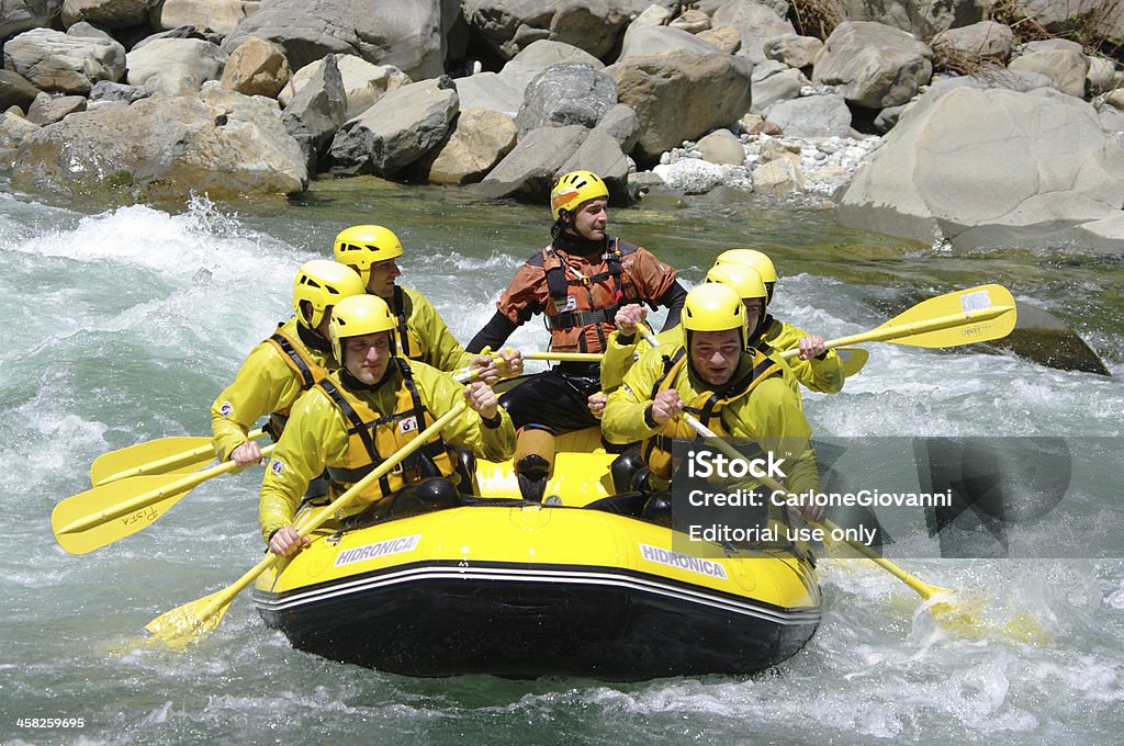 Rafting sport Varallo, Italy - May 20, 2012: A group of boys enjoy a rafting center down the Sesia river in Italy Activity Stock Photo