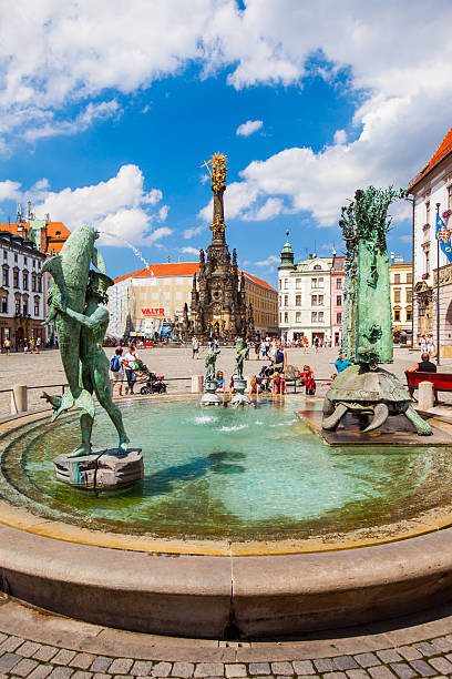 Olomouc, Czech Republic - August 08, 2012: Main square with 35 meters high The Holy Trinity column. Built in honor of God. World Heritage Site by UNESCO.