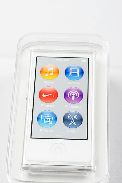 Ipod Nano Mexico City, Mexico - January 15, 2013: Ipod Nano version 2013 with multitouch screen. The image shows a new device in the plastic case with the plastic screen protector on, isolated on white background. ipod nano stock pictures, royalty-free photos & images