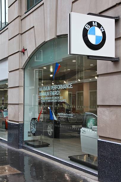 BMW car dealership London, UK - May 14, 2012: BMW car dealership on May 14, 2012 in London. BMW recently enjoyed record annual car sales with 1.85 million cars sold worldwide in 2012. bmw dealership stock pictures, royalty-free photos & images