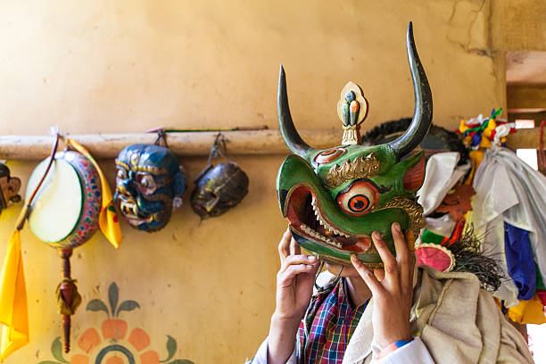 Buthanese man with traditional mask for fire festival in Thangbi stock photo