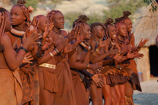 Himba clapping hands Kaokoveld, Namibia - July 17th, 2009: Himba women dancing and clapping hands at their village near Opuwo. Namibia. Himbas are the last nomadic people in Namibia kaokoveld stock pictures, royalty-free photos & images