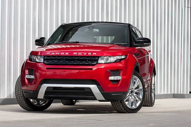 Red range rover evoque 2012 Front view ChiangMai,Thailand - August 2, 2012: A photo of a parked red range rover evoque 2012 on display outside of a car dealership in Thailand,Range rover evoque best sales of the Thailand. evoque stock pictures, royalty-free photos & images