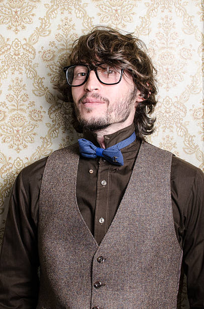 istock Young bearded fashionable man with glasses and bowtie 458264319