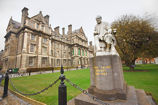 Trinity College Dublin, Ireland - April 1, 2013: George Salmon statue and building at  Trinity College in Dublin Ireland on April 1, 2013.  The college was founded in 1592 as the "mother" of a new university and is located in Dublin's College Green. trinity college library stock pictures, royalty-free photos & images