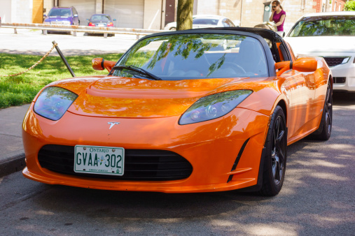 Hamilton, Canada - July 13, 2013: Tesla Roadster electric sports car parked on the street in Hamilton, Ontario.