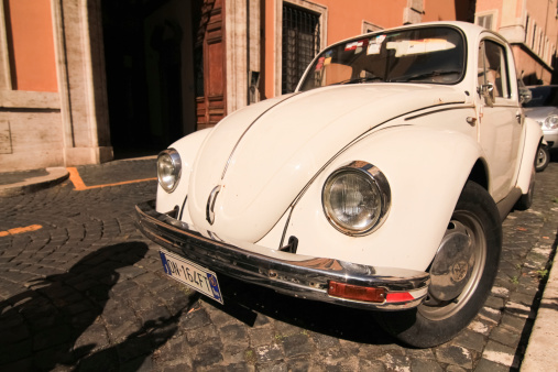 Rome, Italy - September 20th, 2012: Classic VW Beetle Parked In Rome. The Volkswagen Beetle, officially called the Volkswagen Type 1 (or informally the Volkswagen Bug), is an economy car produced by the German auto maker Volkswagen (VW) from 1938 until 2003.