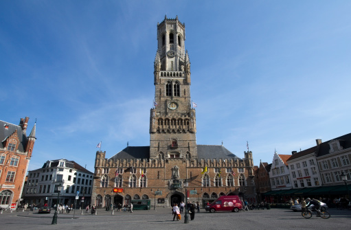 Aerial view on Bruges belfry and the town, in Belgium. May 27, 2022