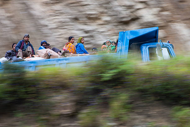 Indian immigrant labourers on their way to work stock photo